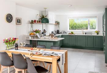 The large open-plan kitchen and dining area has plenty of space for all the family.