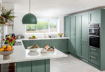 The kitchen is modern and stylish with plenty of worktop space.