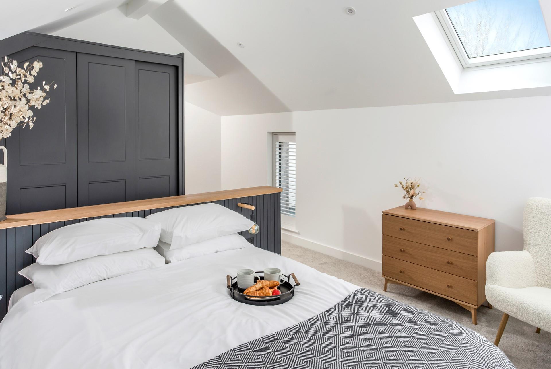 The spacious top bedroom is a tranquil space to relax.