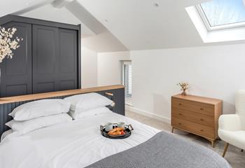 The spacious top bedroom is a tranquil space to relax.