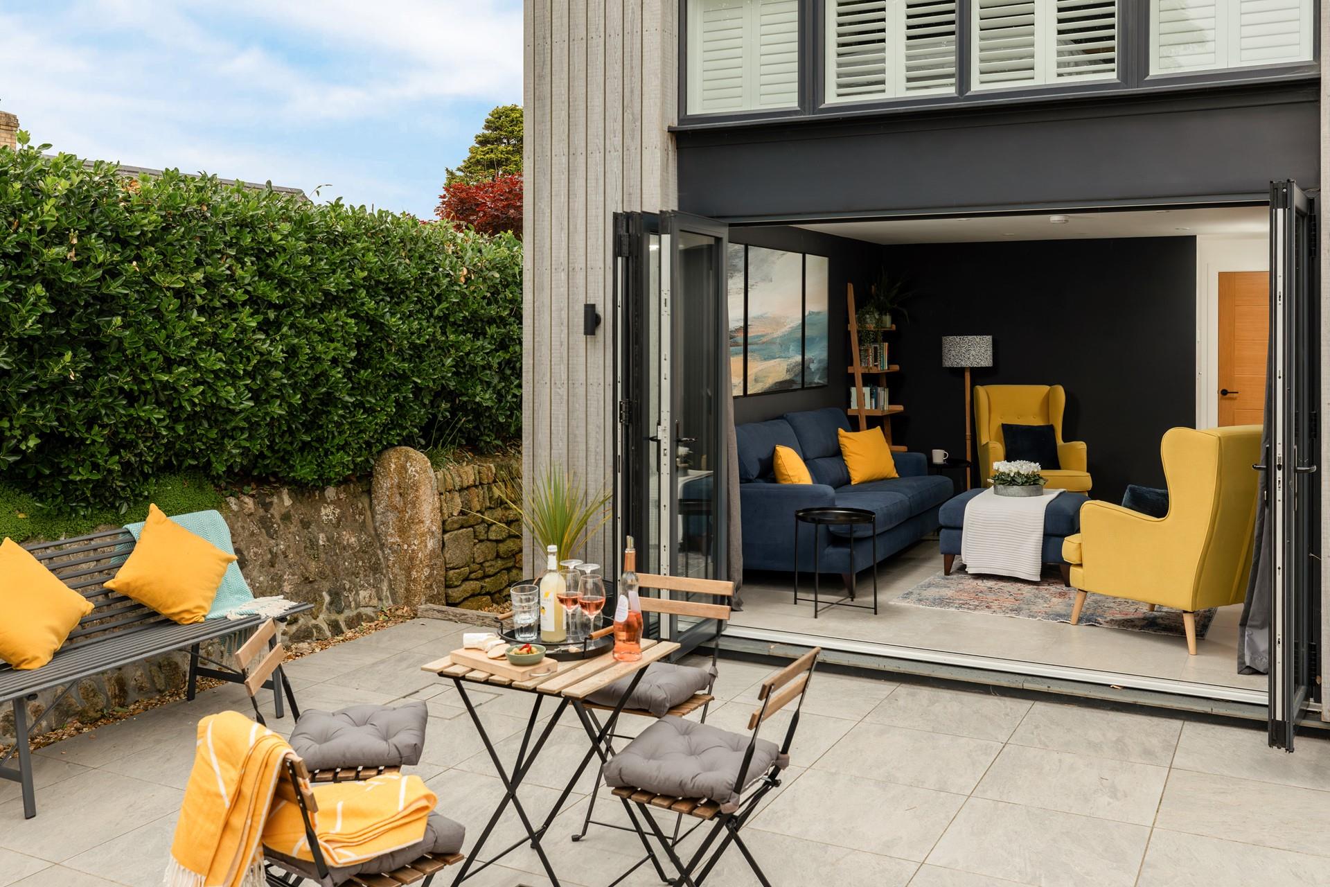 Enjoy a drink and nibbles on the patio.