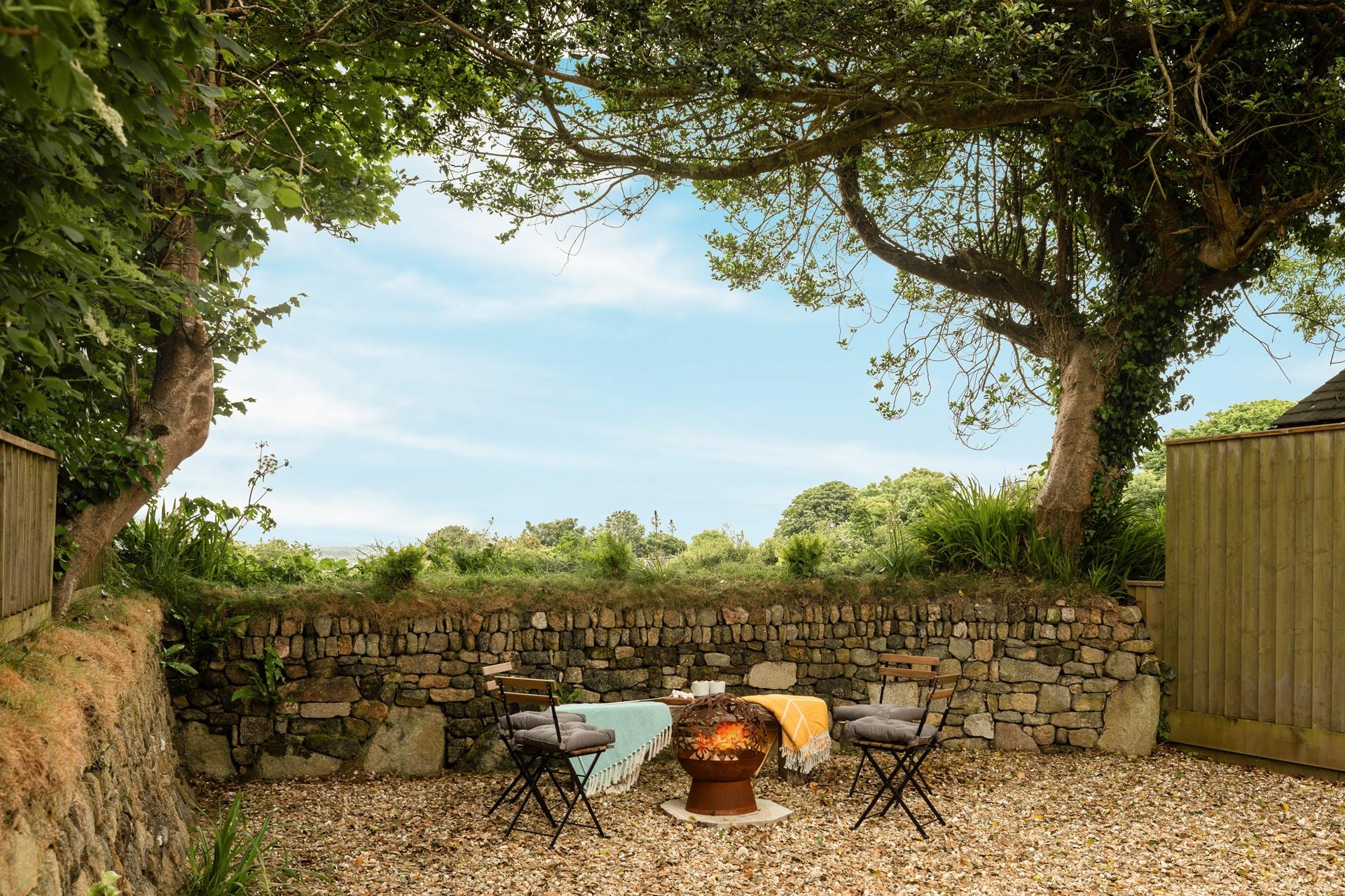 Sit around the fire pit in the evening as the sun goes down.