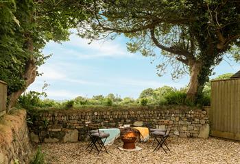 Sit around the fire pit in the evening as the sun goes down.