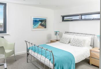 Relax in the king size bed after a day spent on Perranporth beach.