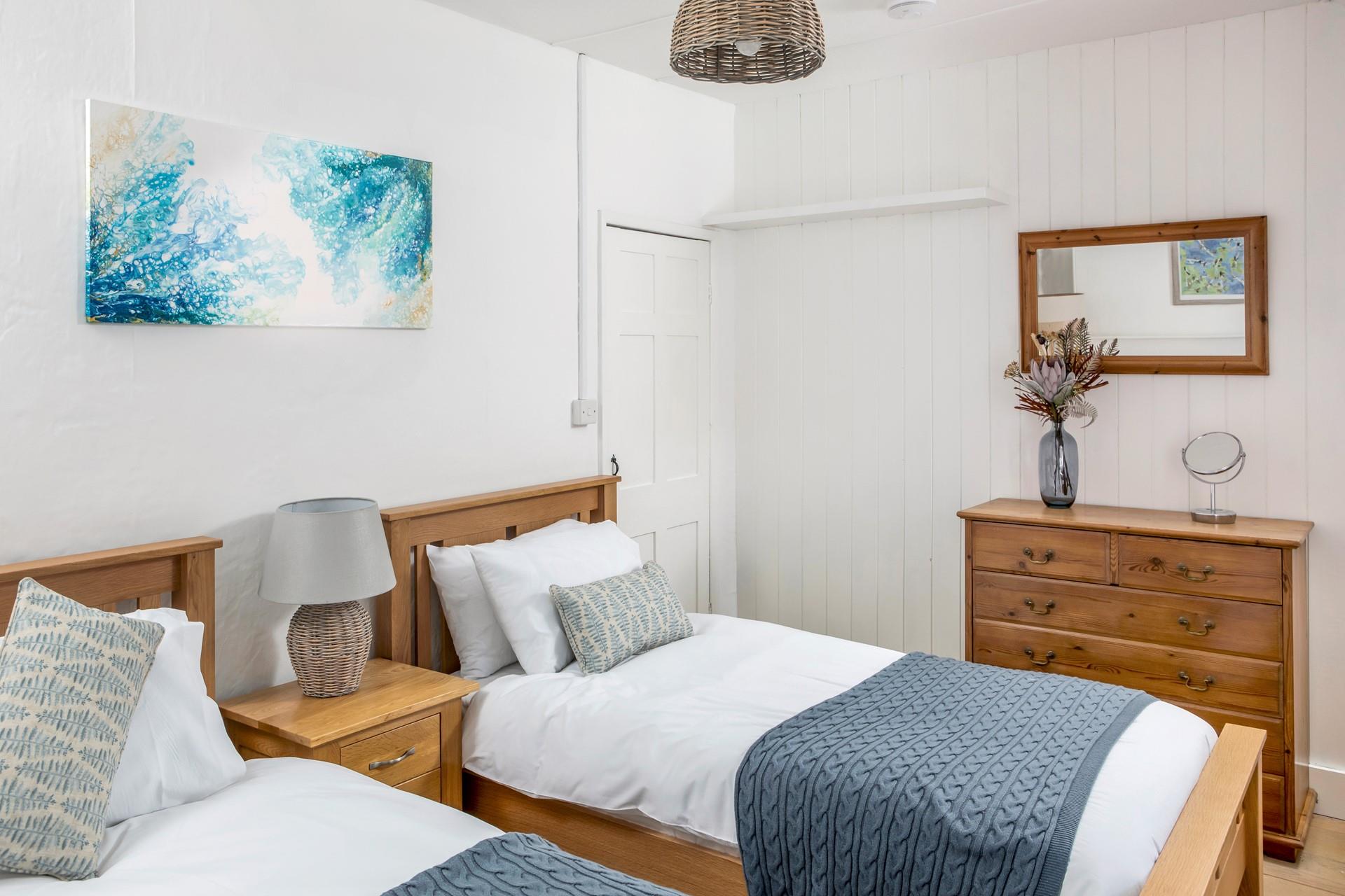 The bedrooms are spacious and decorated with seaside blues.