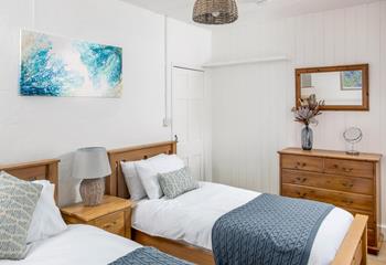 The bedrooms are spacious and decorated with seaside blues.