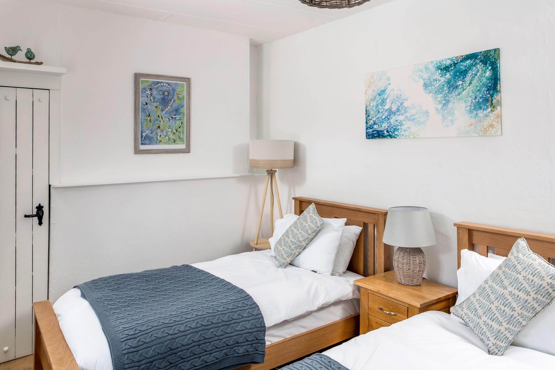 The twin beds are perfect for young adults or children to tuck into.