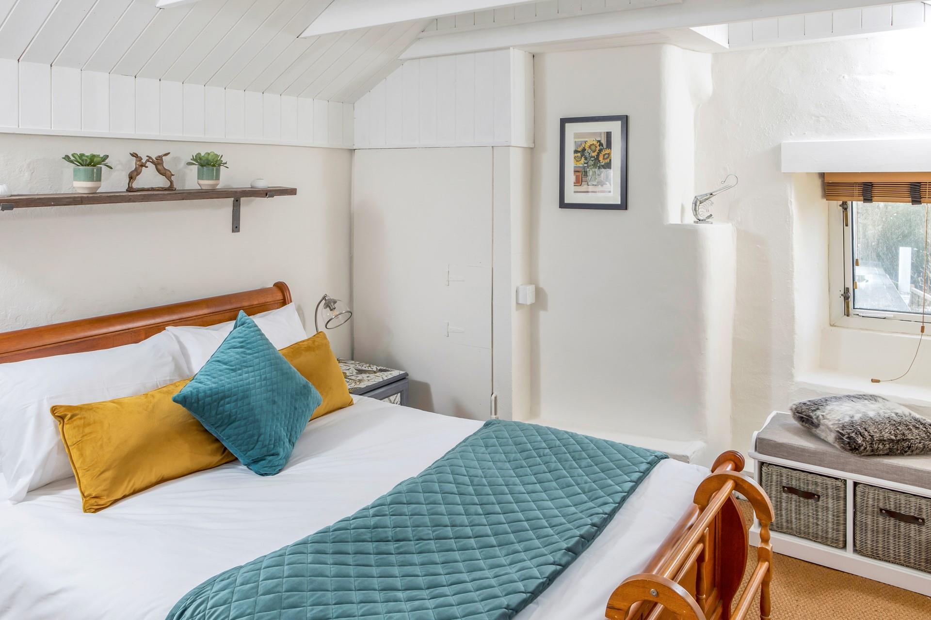 Bright decor adds a splash of colour to bedroom 2.