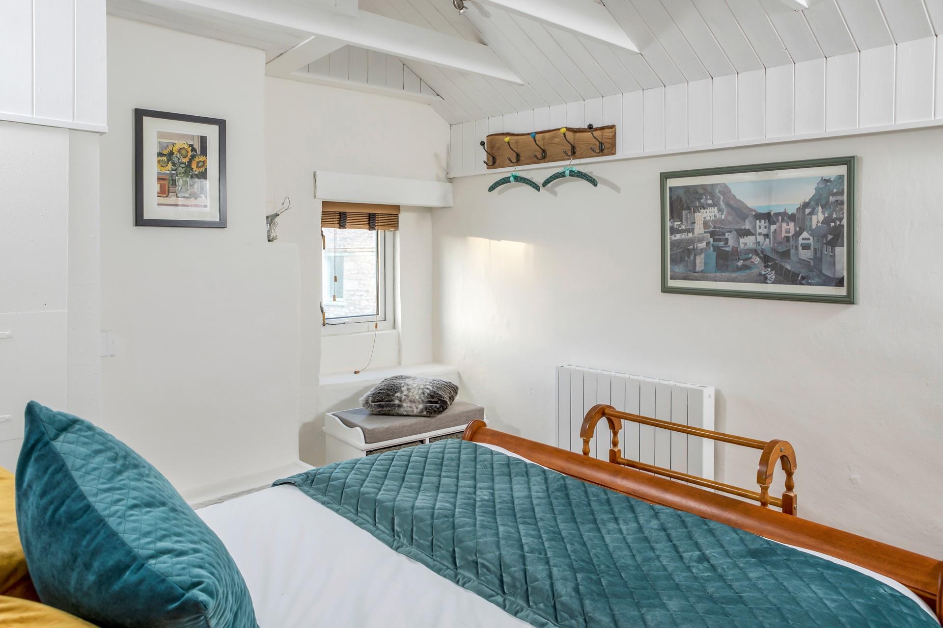 Spend evenings unwinding with a good book in the cosy bedroom.