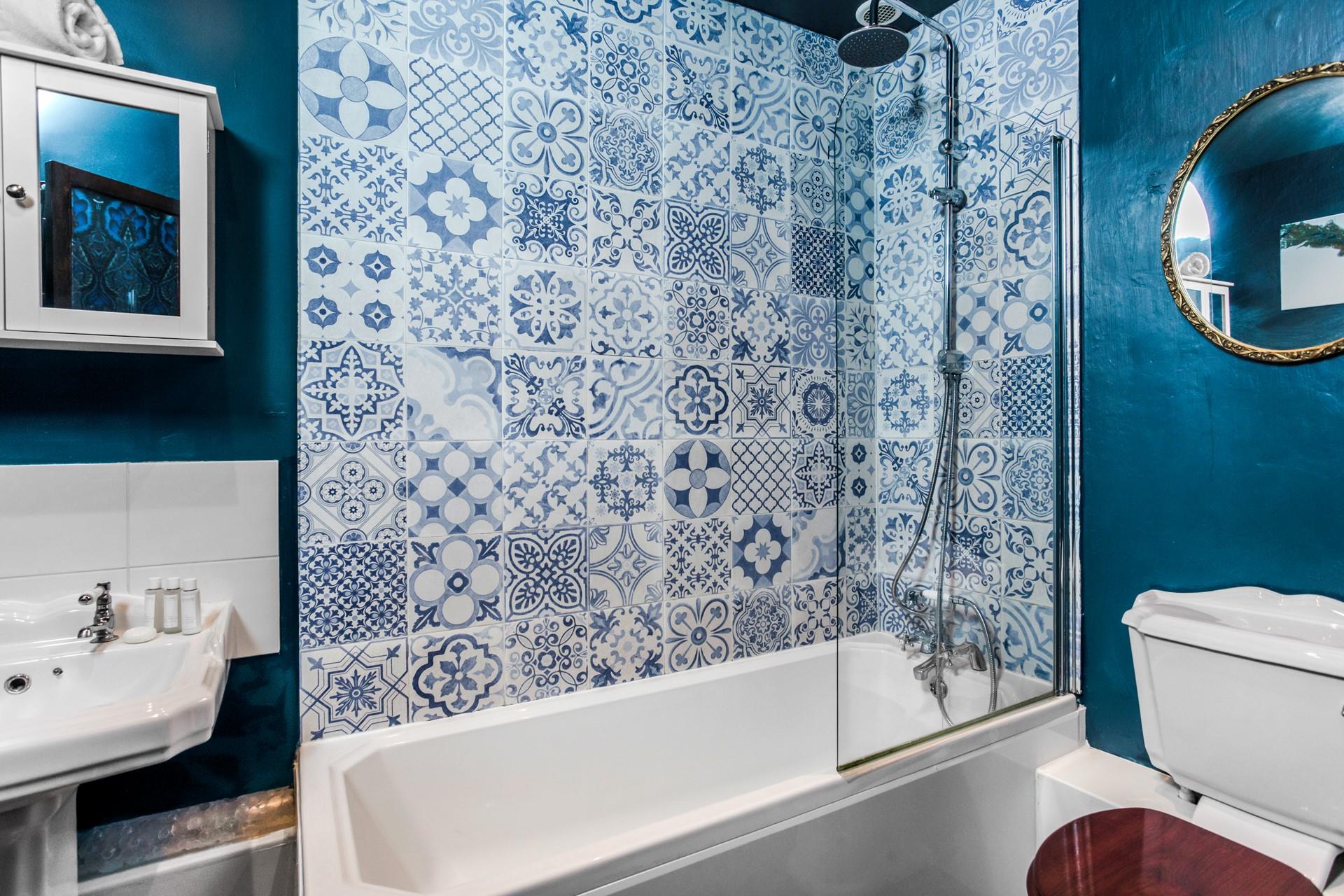 The bathroom is modern and stylish for washing off sandy toes.