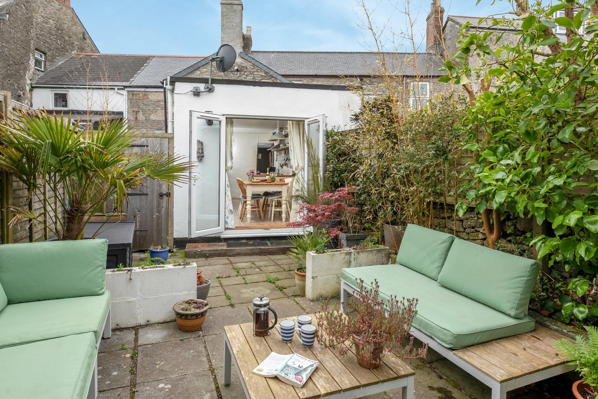 Relax in the sunny garden with a fresh pot of coffee.