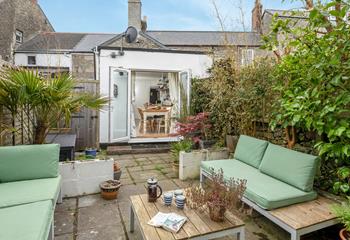 Relax in the sunny garden with a fresh pot of coffee.