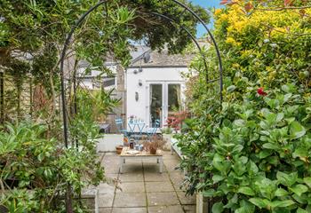 The leafy garden is perfect for sitting and soaking up the sun.