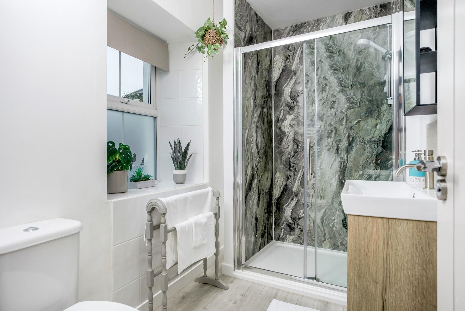 Wash off sandy toes in the modern shower room.