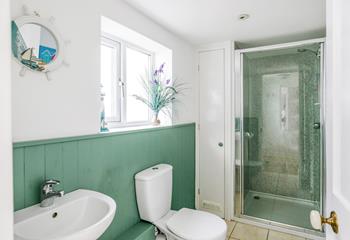 The downstairs shower room is perfect for washing off sandy toes after beach days.