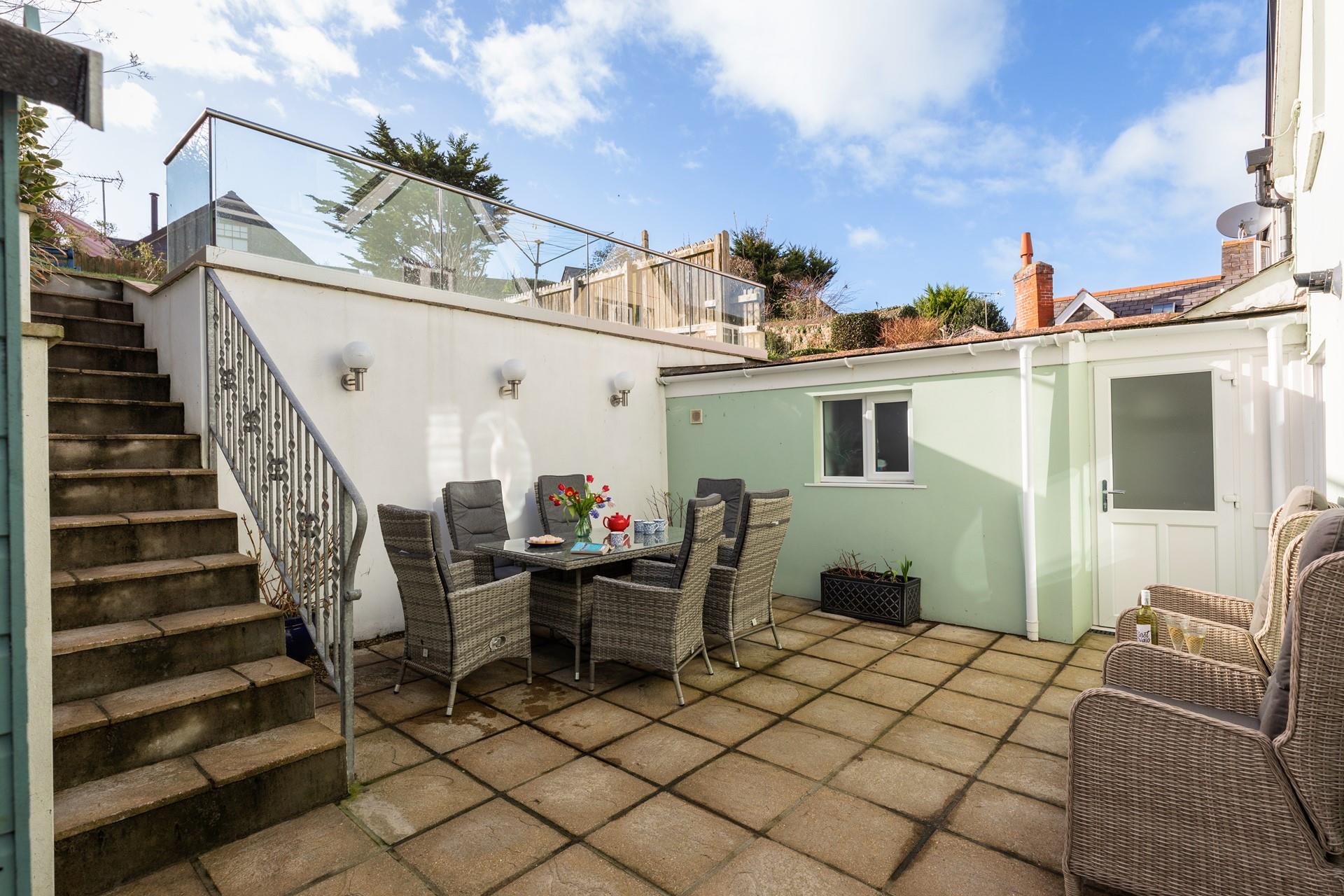 Sit and soak up in the sun in the garden.