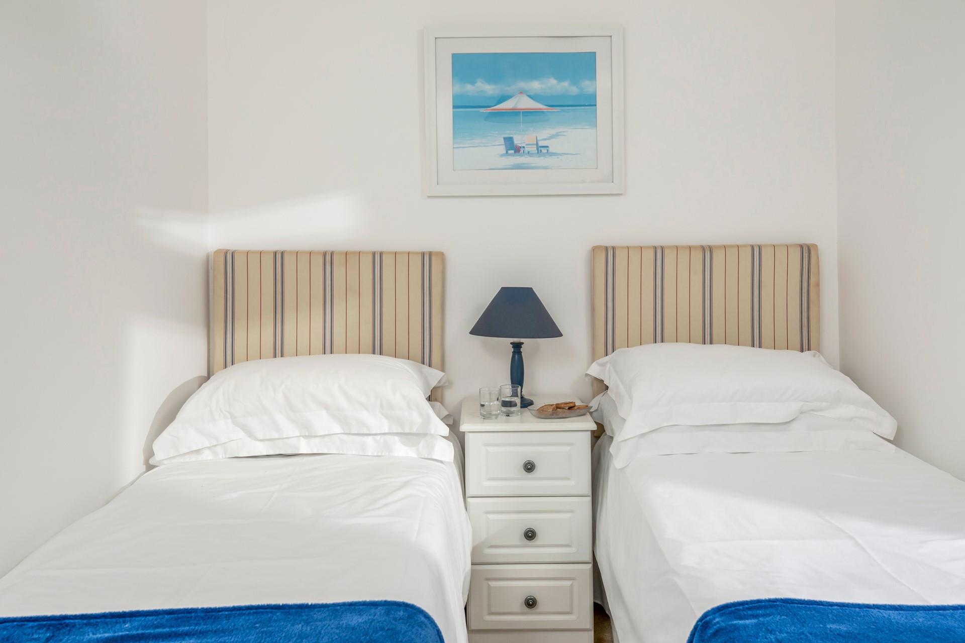 Bedroom 3 has additional twin beds.