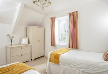 Bedroom 2 has a wardrobe and chest of drawers, plenty of space for holiday wear.