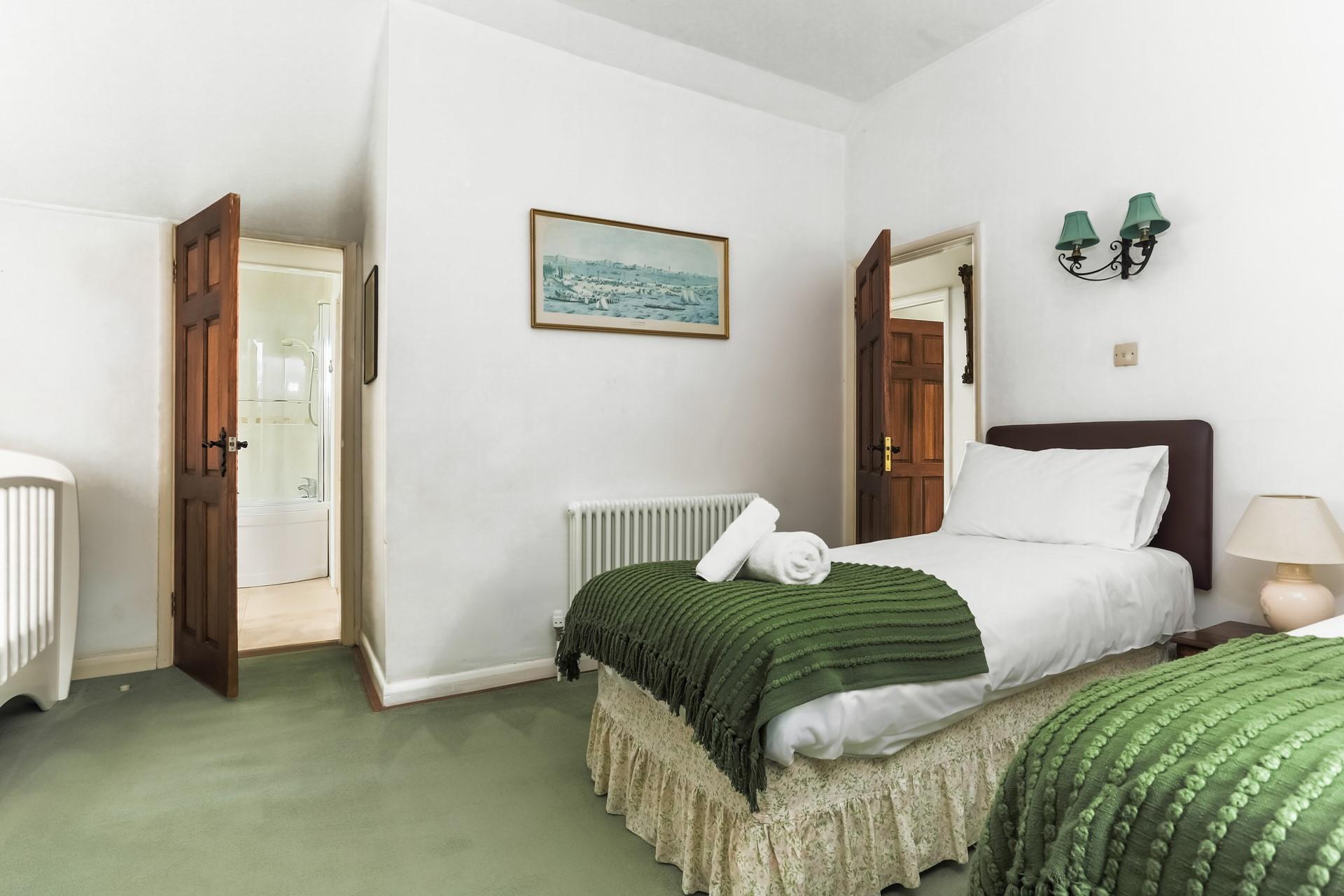 Wake up and wander into the en suite to get ready for the day.