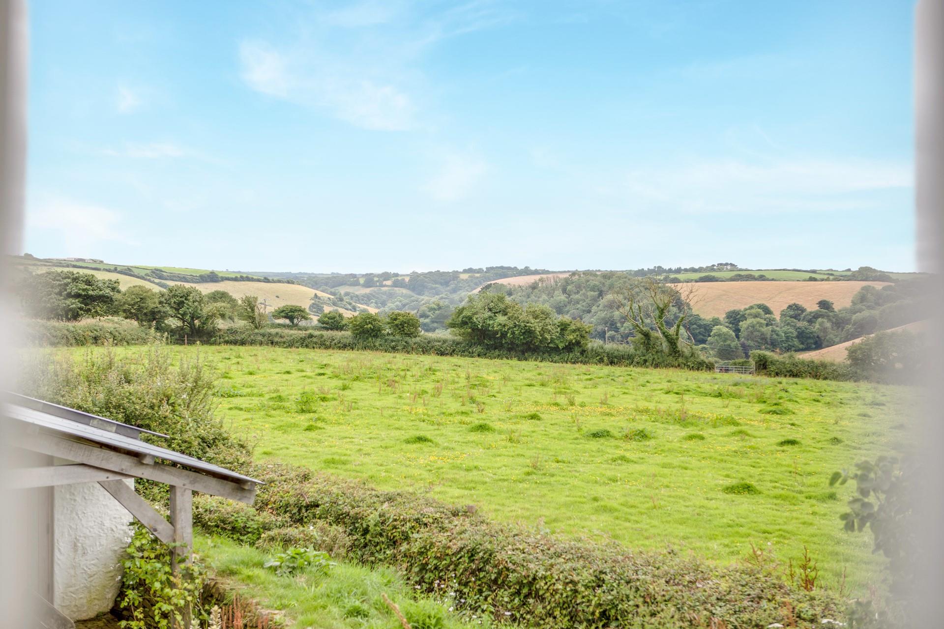 Countryside views stretch over the fields from this cute cottage.