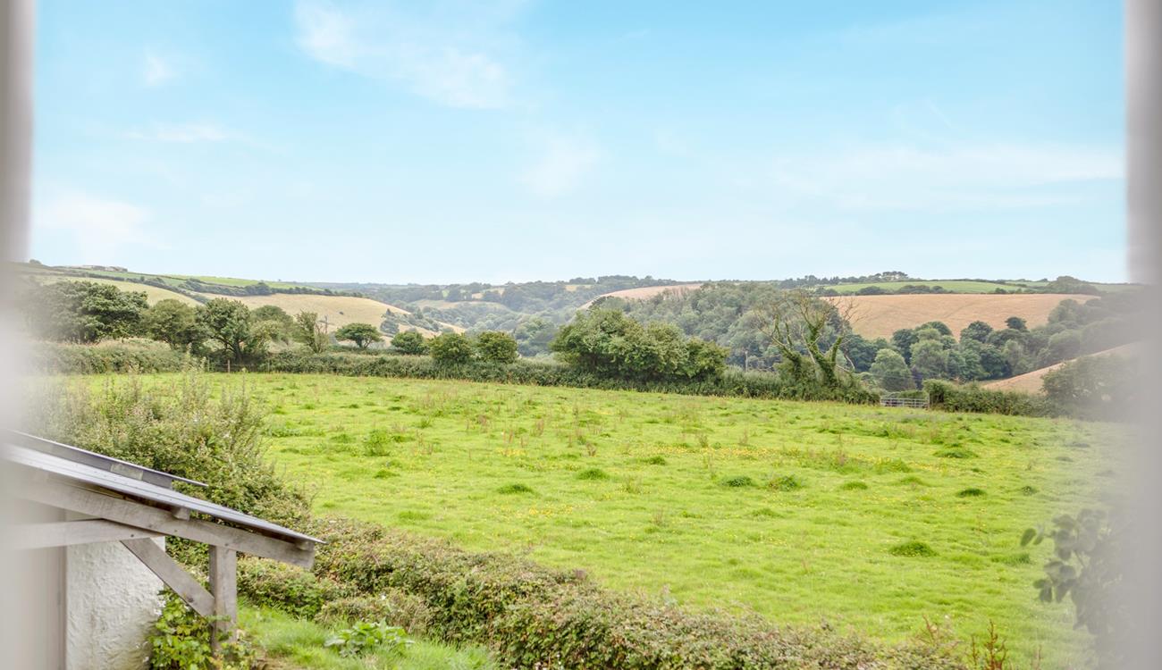 Countryside views stretch over the fields from this cute cottage.