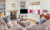 The cosy sitting room is the ideal base to unwind in the evenings. - Thumbnail Image