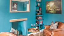 The snug area has additional seating and is a quiet space to enjoy a drink and some board games.