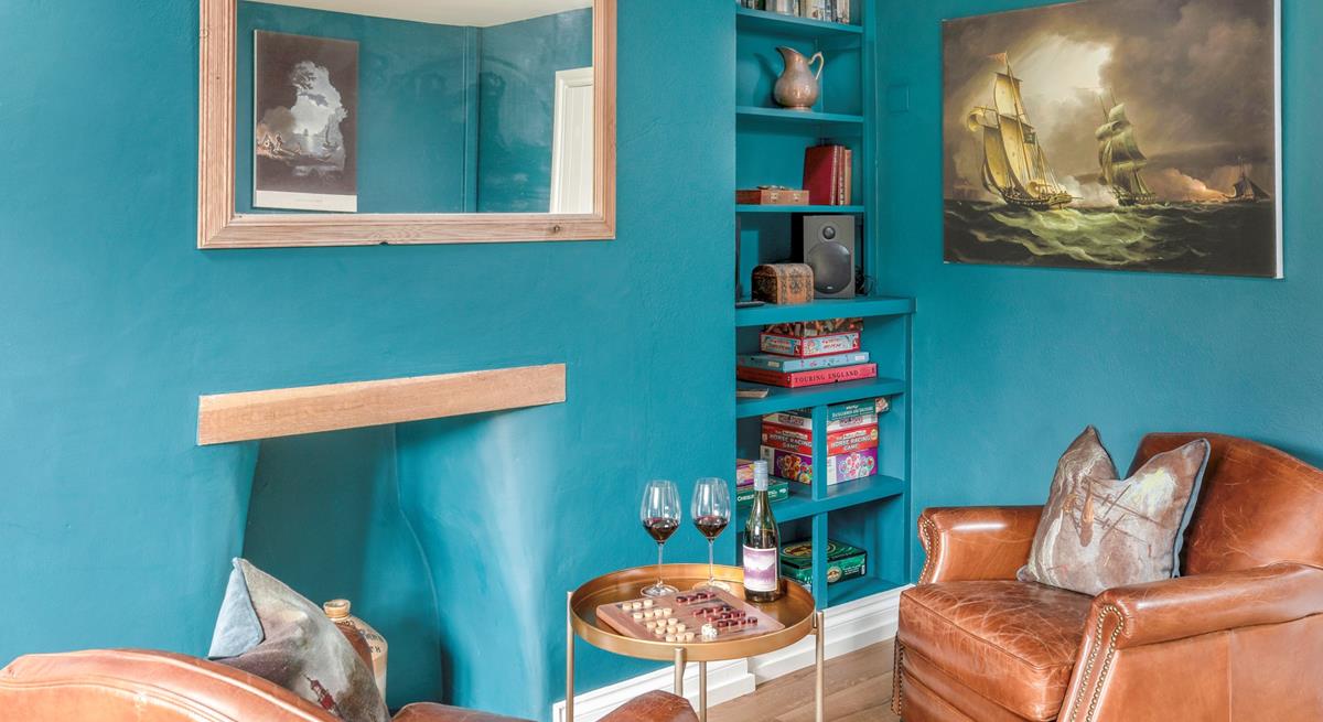 The snug area has additional seating and is a quiet space to enjoy a drink and some board games.