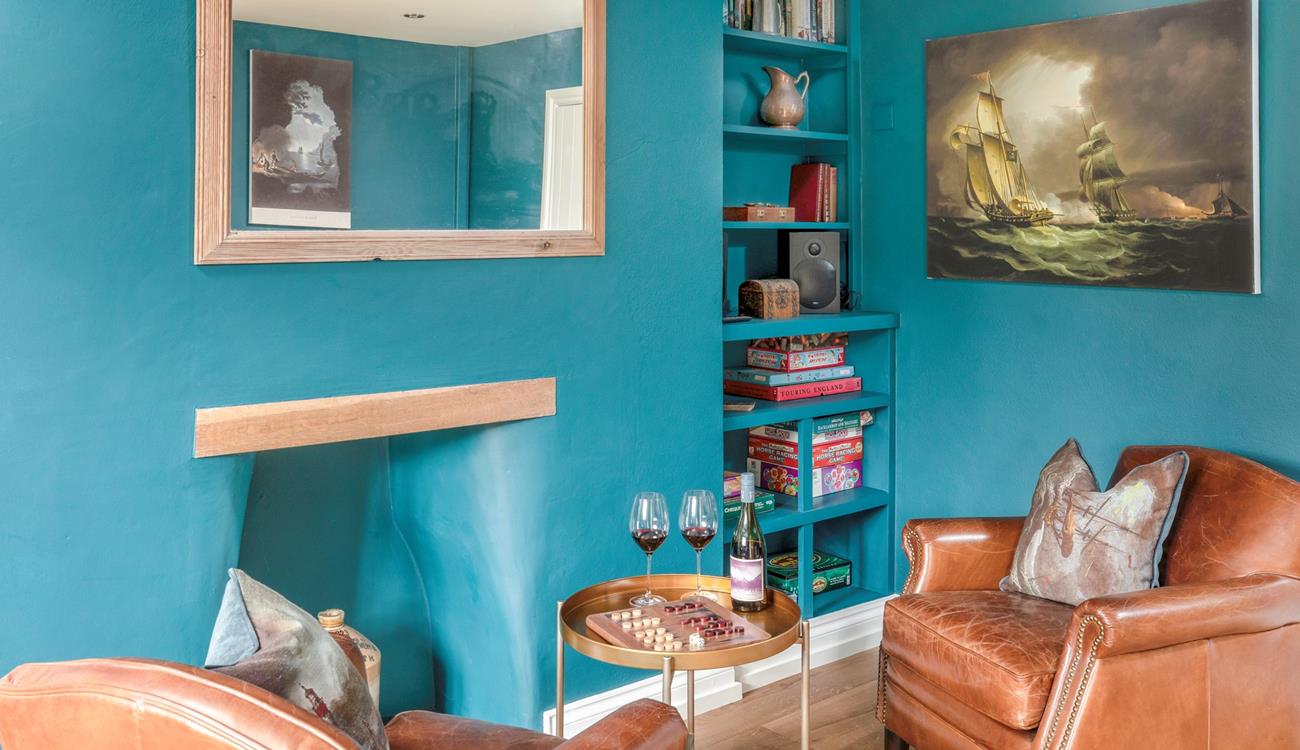 The snug area has additional seating and is a quiet space to enjoy a drink and some board games.