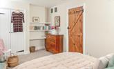 The bedrooms are tastefully decorated to retain the cottage charm. - Thumbnail Image