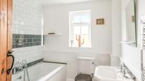 Get ready each morning in the modern bathroom.