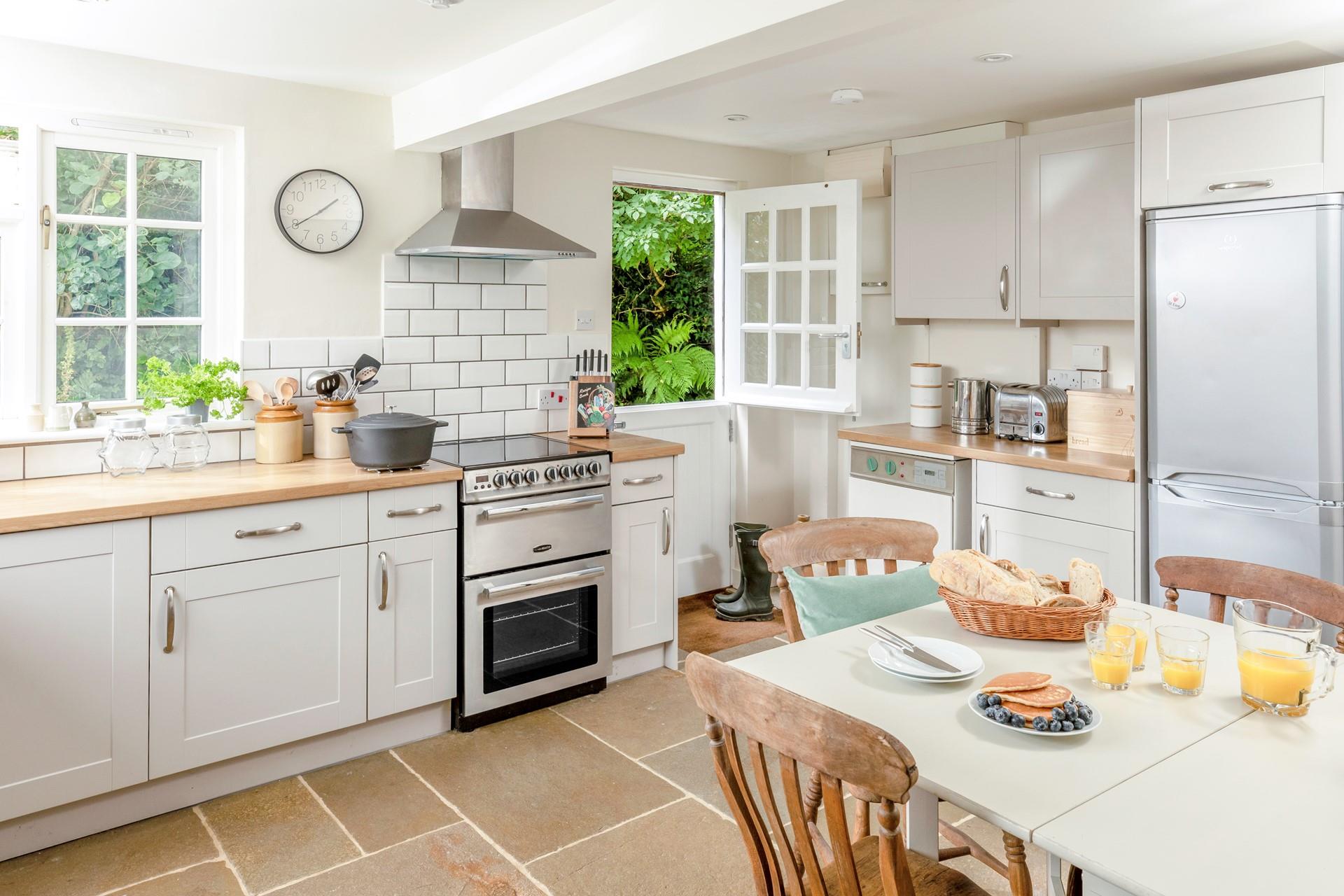 The kitchen is modern and well-equipped for cooking meals.