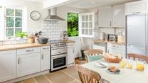 The kitchen is modern and well-equipped for cooking meals.