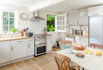 The kitchen is modern and well-equipped for cooking meals.