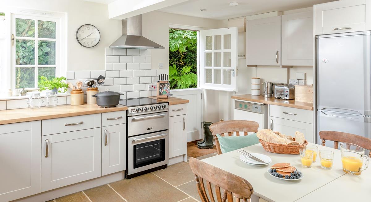 The kitchen is modern and well-equipped for cooking meals.