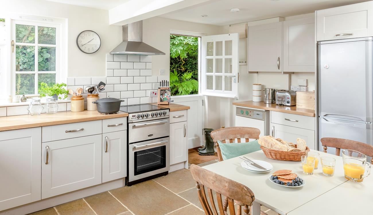 The kitchen is modern and well-equipped for cooking meals.