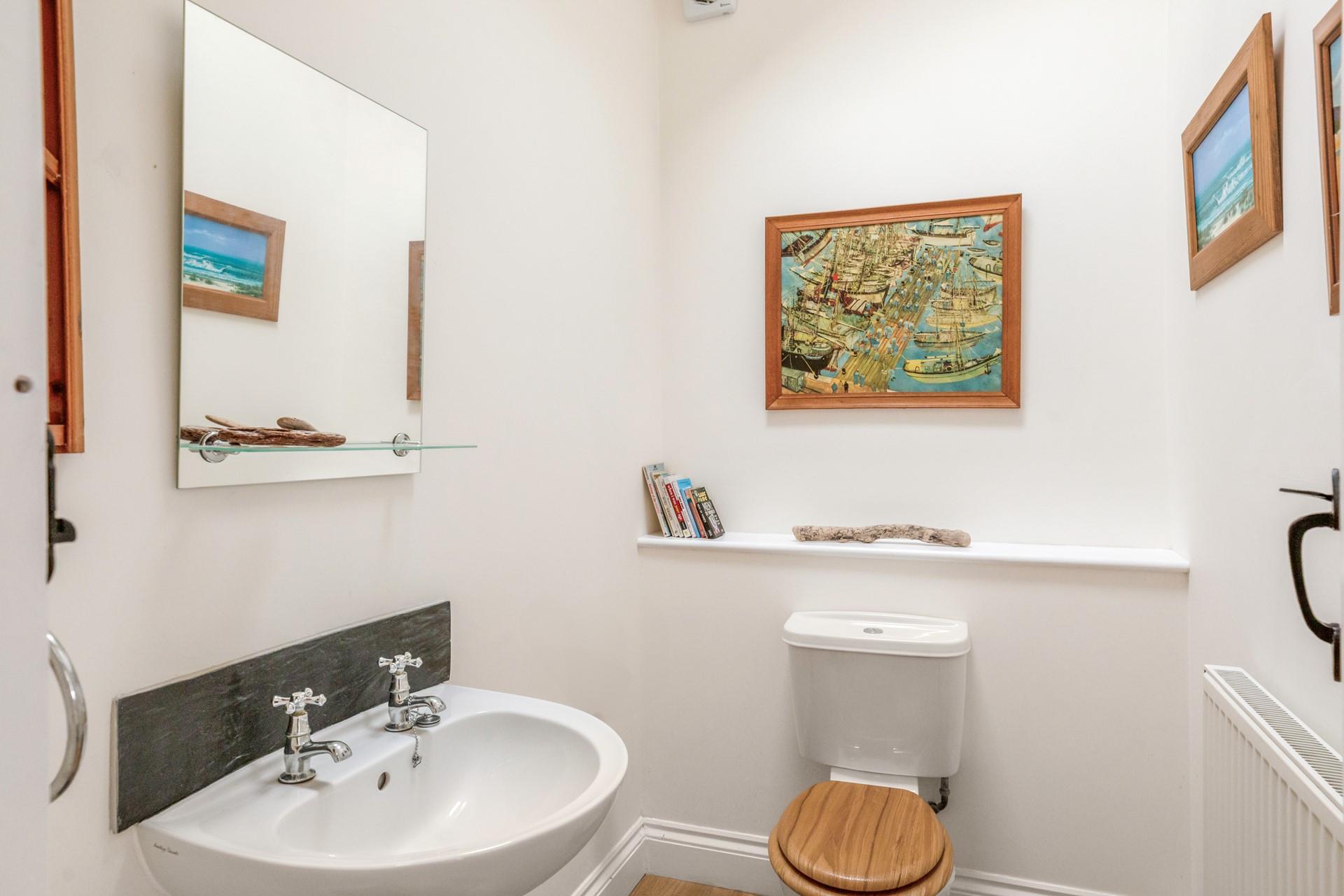 There is a downstairs WC and basin.