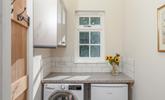 The utility room has a washer/dryer. - Thumbnail Image