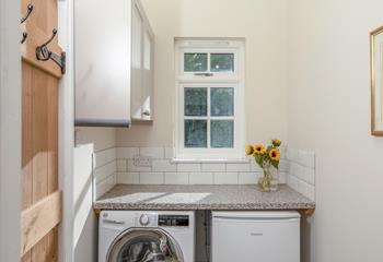 The utility room has a washer/dryer.