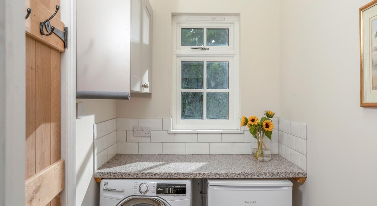 The utility room has a washer/dryer.