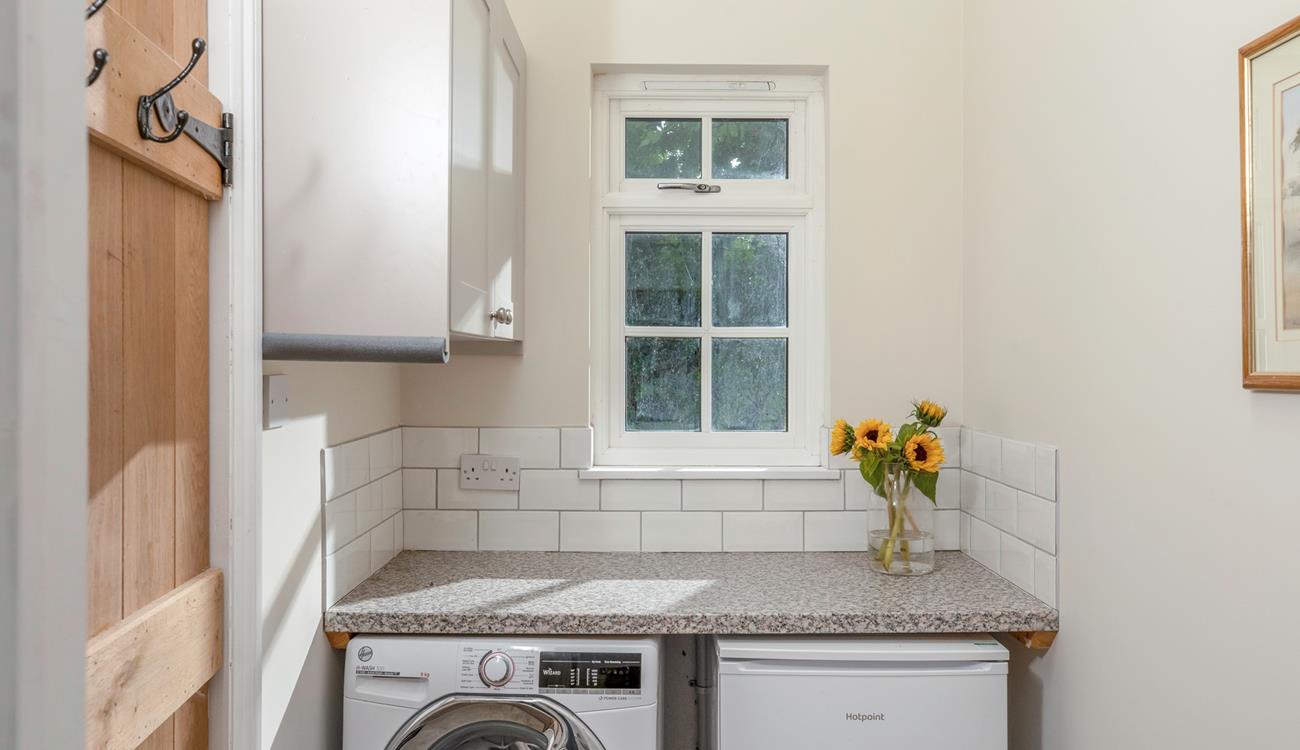 The utility room has a washer/dryer.