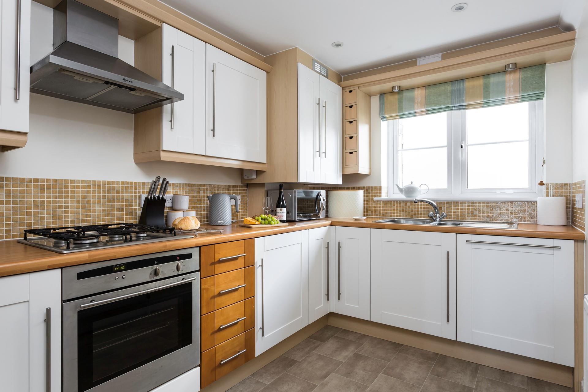 The fully equipped kitchen is perfect for cooking up a storm.