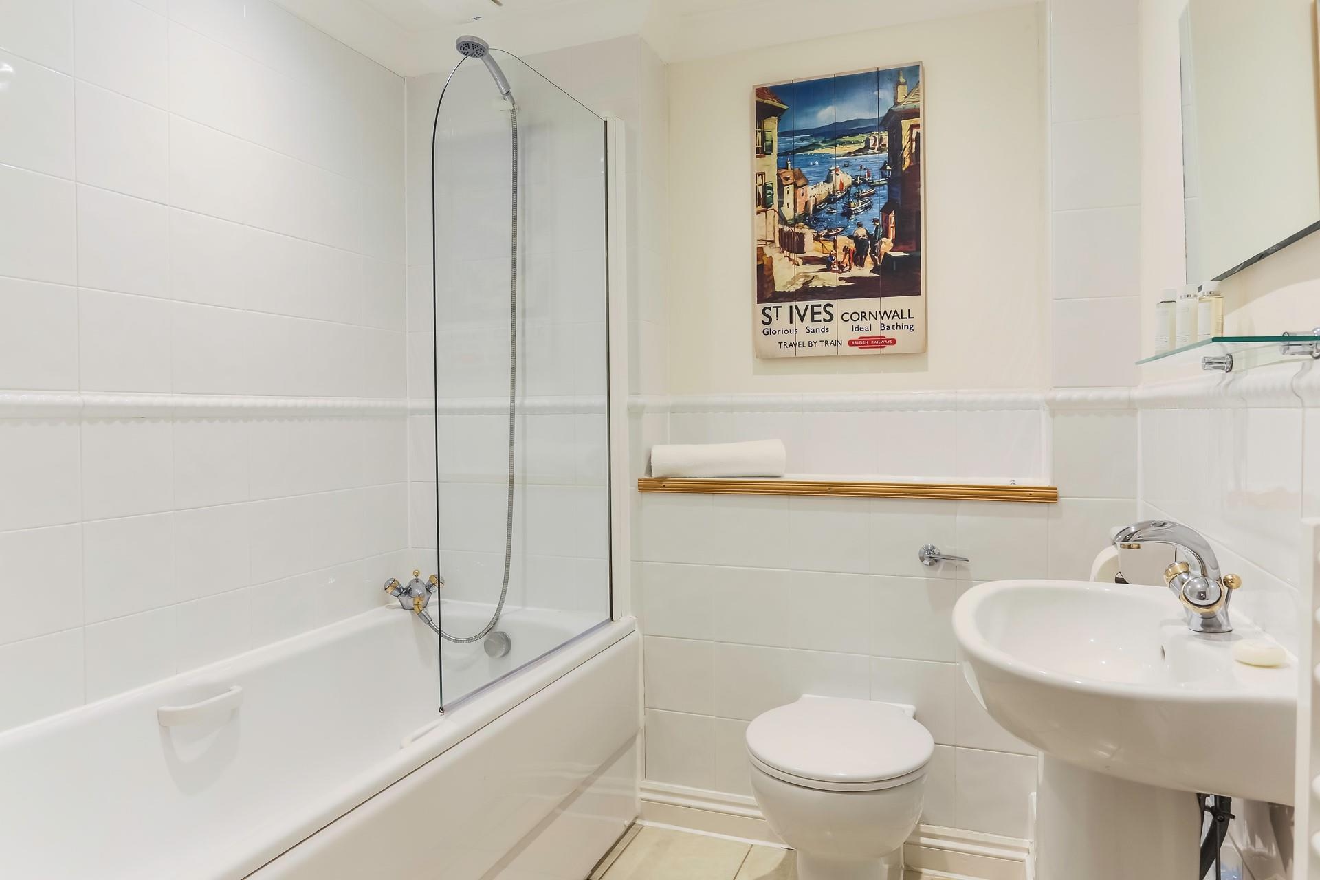 Relax and unwind in the family bathroom.