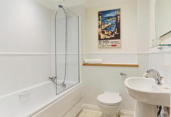 Relax and unwind in the family bathroom.