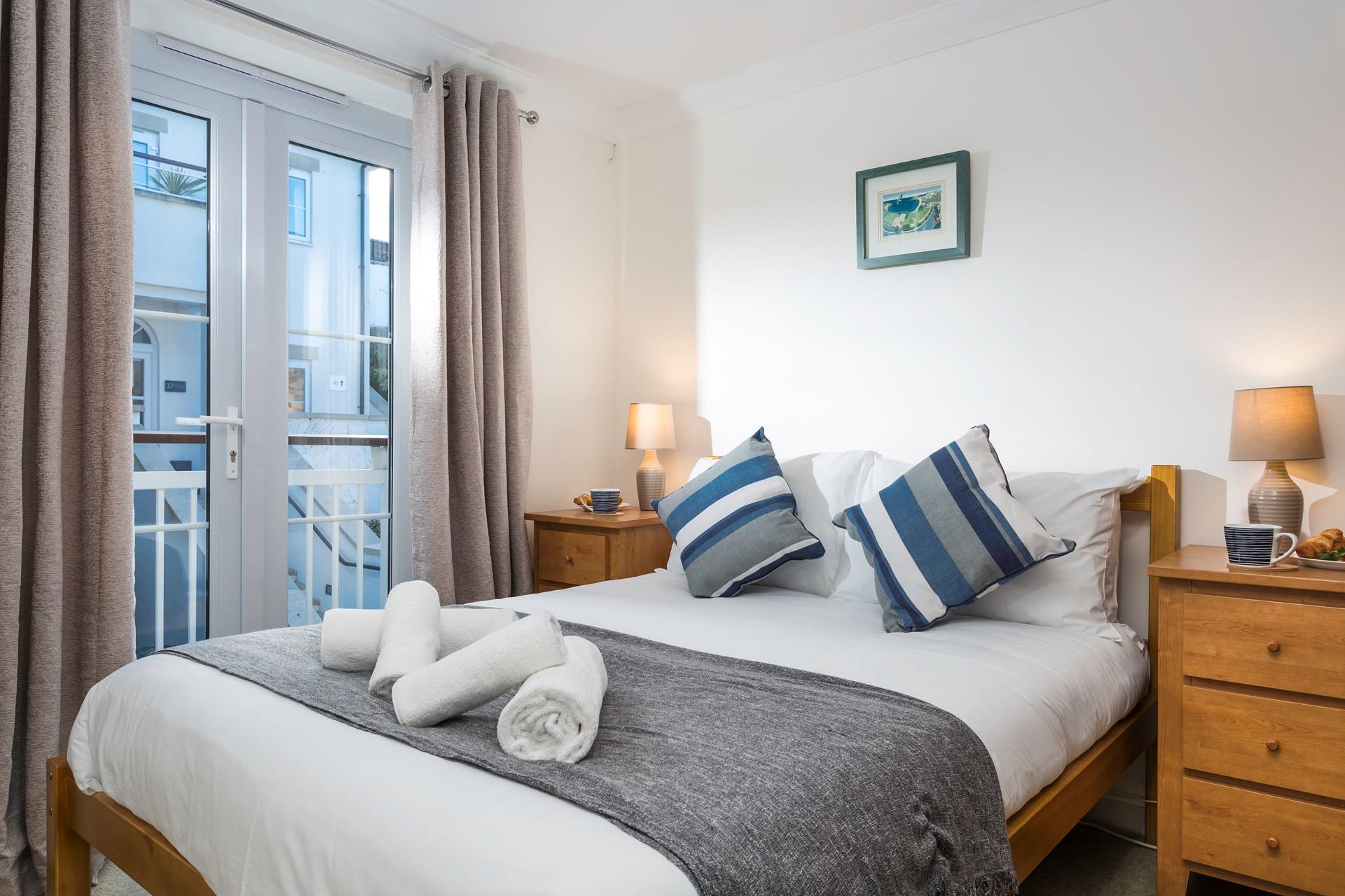 The bedrooms are decorated with pops of seaside blue.