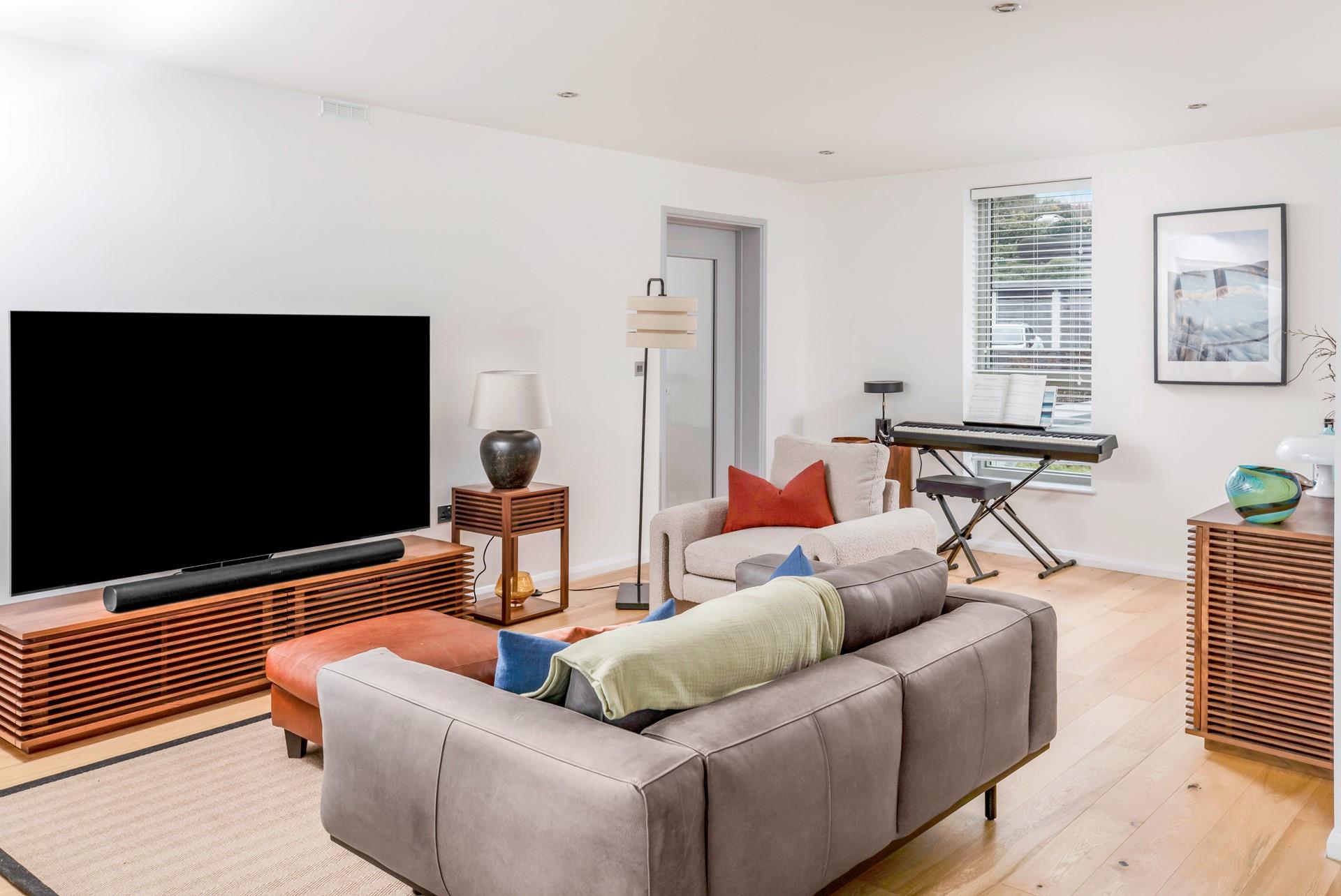 Light and contemporary, the open plan living space is a great base to relax each evening.