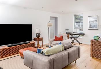 Light and contemporary, the open plan living space is a great base to relax each evening.