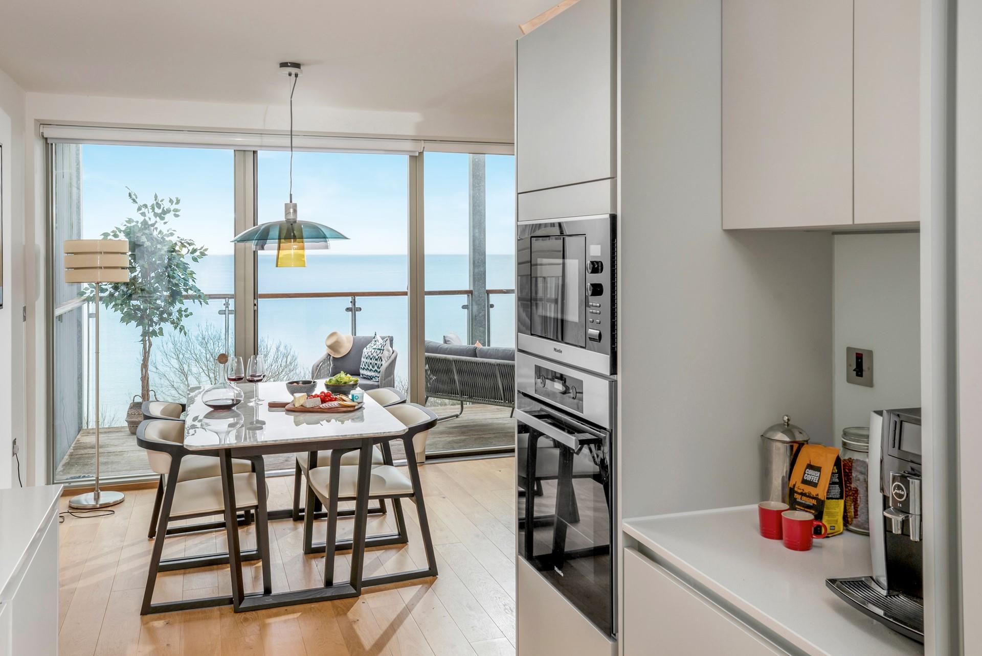 Tuck into a tasty meal with the sea view backdrop.