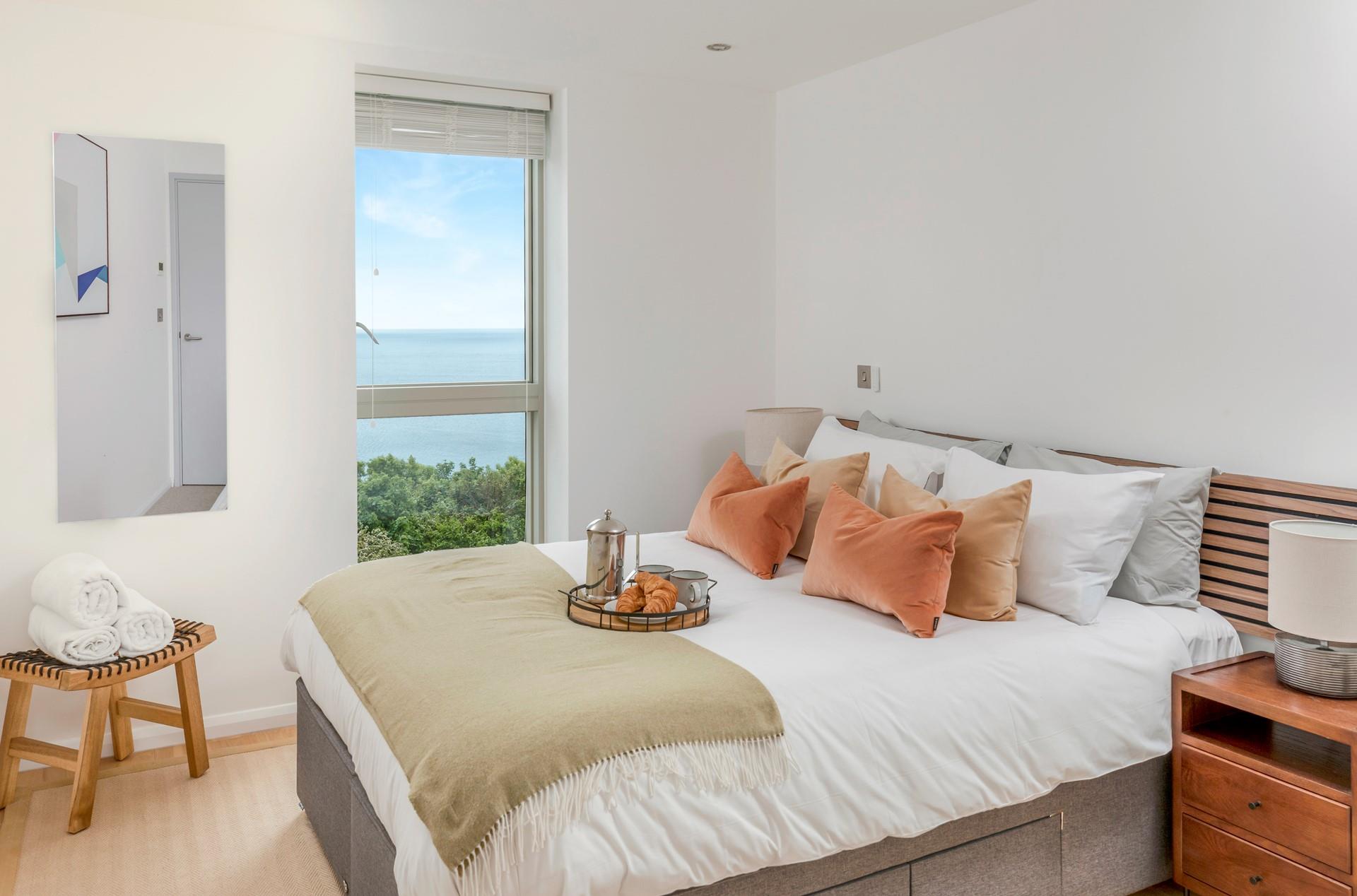 Wake up to sea views in the bedroom.