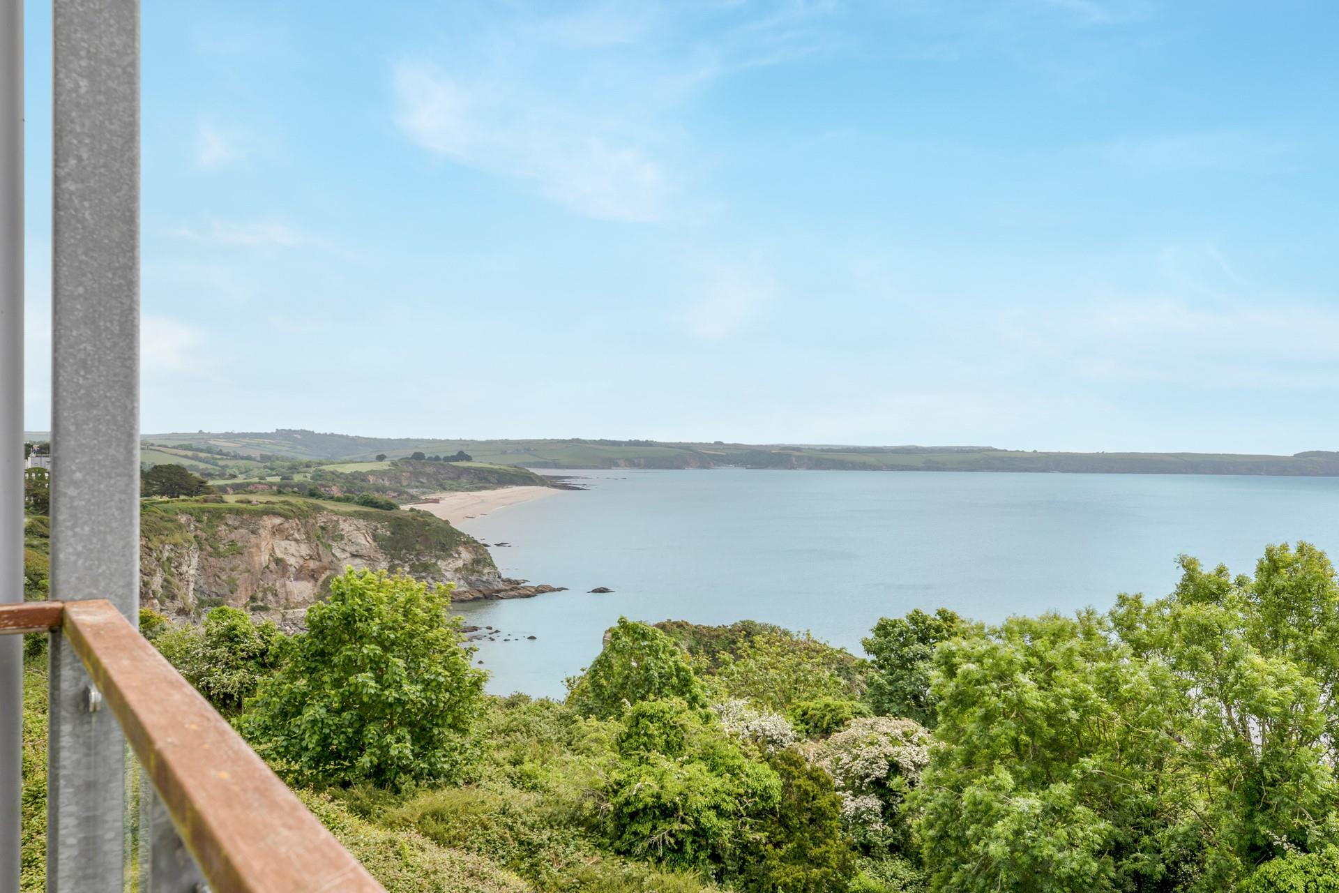 Soak up sun and sea views on the balcony.